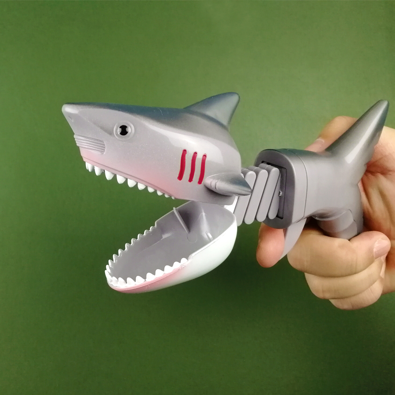 啄食者恐龙鲨鱼伸缩弹簧机械手夹子创意减压整蛊儿童玩具生日礼物